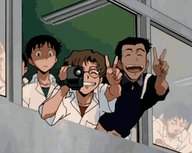 a group of people are looking out of a window and one of them is holding a camera