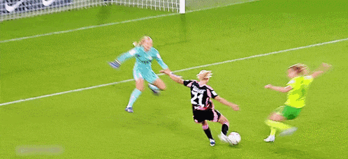 a soccer player wearing a number 21 jersey is kicking the ball