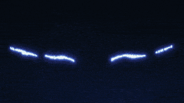 a pixelated image of a skull with horns and red eyes