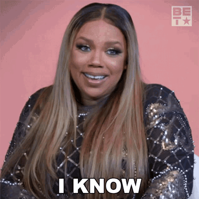 a woman says i know while wearing a sequined top