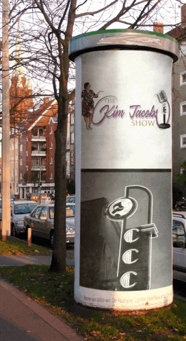 a billboard for the kim jacobs show is on a pole