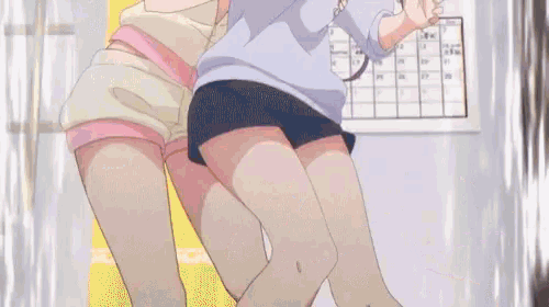 two anime girls are hugging each other in front of a calendar