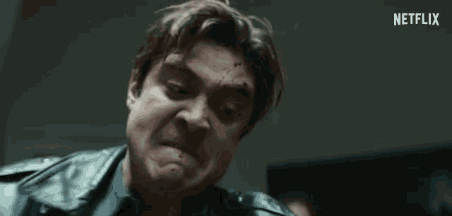 a close up of a man 's face with the word netflix on the bottom