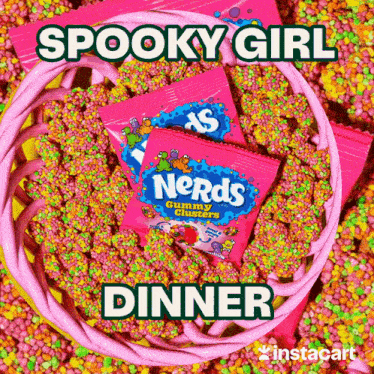 two bags of nerds gummy clusters in a bowl of colorful sprinkles