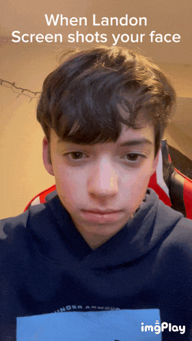 a screenshot of a boy 's face with the caption when landon screen shots your face