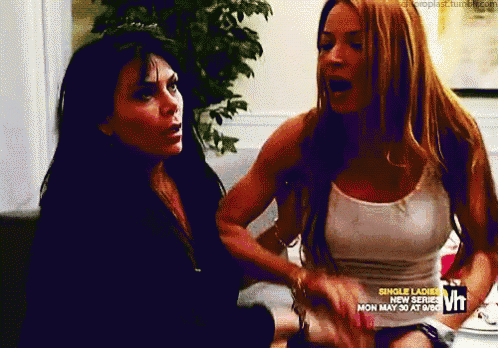 two women are sitting next to each other with the words single ladies on the bottom right