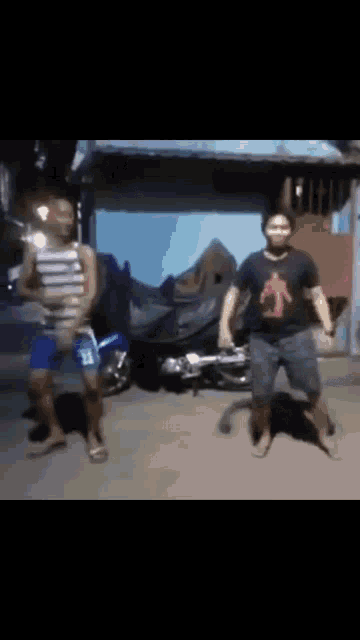 two men are dancing in front of a motorcycle with the number 11 on their shorts