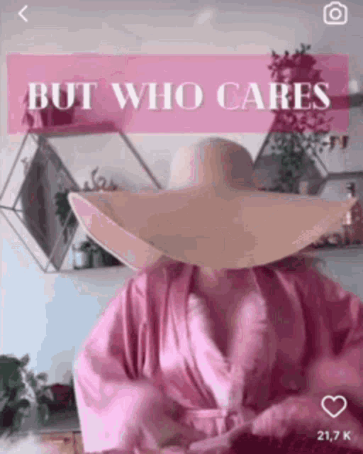 a woman wearing a pink robe and a hat with the words but who cares on the bottom