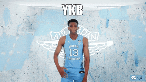 a basketball player from north carolina is pointing