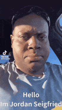 a man wearing sunglasses and a blue shirt says hello im jordan seigfried