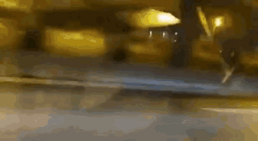 a blurry picture of a city street at night