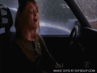 a woman is crying in a car with a make gifs at gifsoup.com url