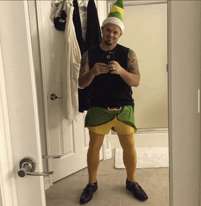 a man is taking a picture of himself in a mirror