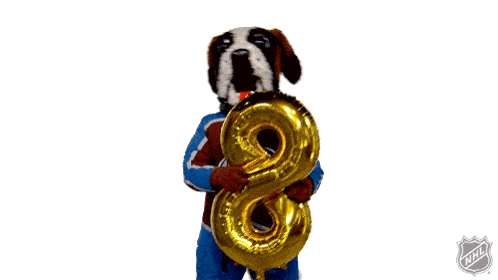 a mascot holding a number eight balloon with the nhl logo on the bottom