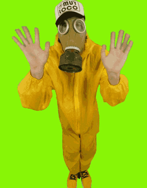 a man wearing a gas mask and a hat that says muy loco on it