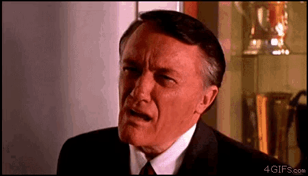a close up of a man 's face with the website 4gifs.com visible