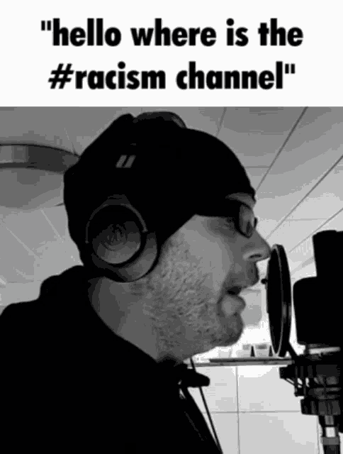 a man singing into a microphone with the words " hello where is the #racism channel " on the bottom