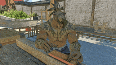a man with a tattoo on his chest sits at a wooden table working on a piece of wood