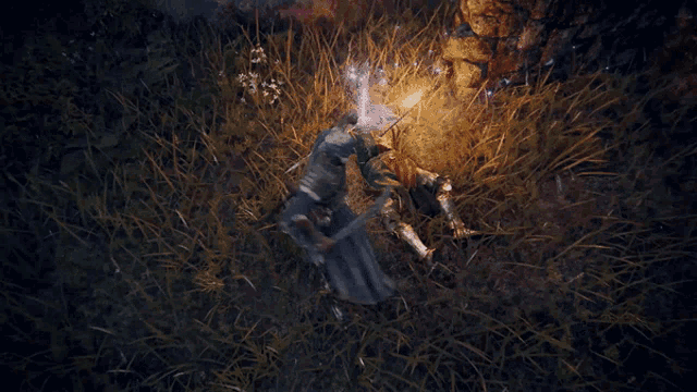 a person in a blue robe is laying in the grass