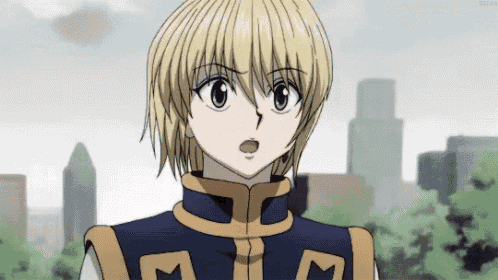 a close up of a cartoon character with a surprised look on his face .