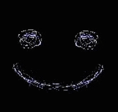 it looks like a smiley face made of water drops .