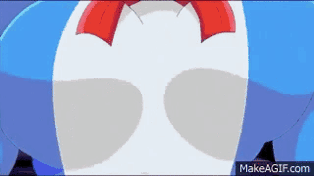 a close up of a blue and white cartoon character 's butt with a red bow .