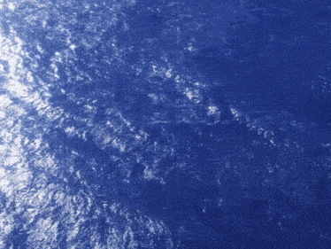 a close up of a blue surface with waves