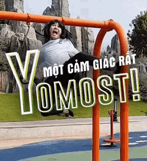 a girl is swinging on a swing with yomost written on the bottom
