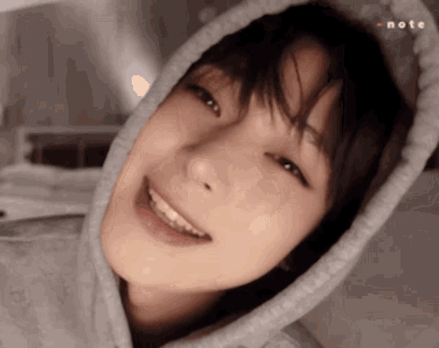 a close up of a person wearing a hooded sweatshirt