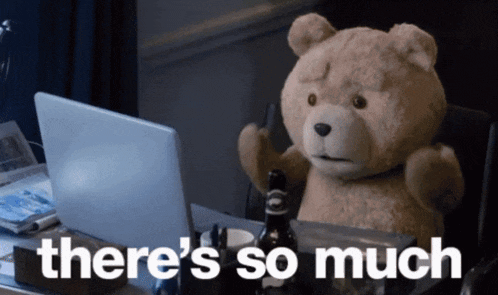 a teddy bear is sitting in front of a laptop with the words " there 's so much " written below it
