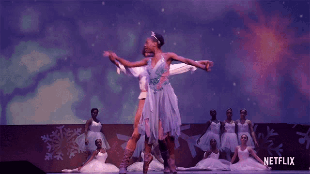 a group of ballet dancers are performing on a stage with a netflix logo in the background