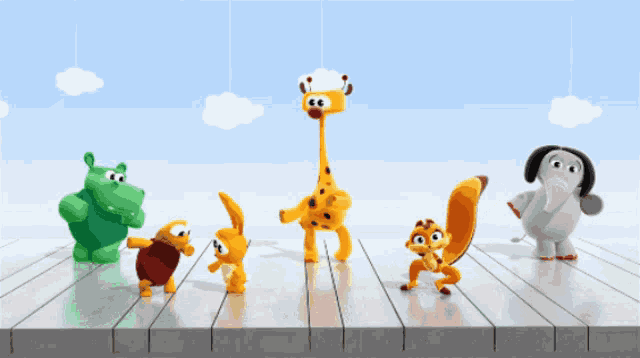 a group of stuffed animals including a giraffe and a hippo