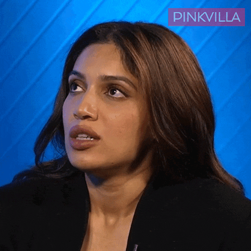 a close up of a woman 's face with a pinkvilla logo in the background