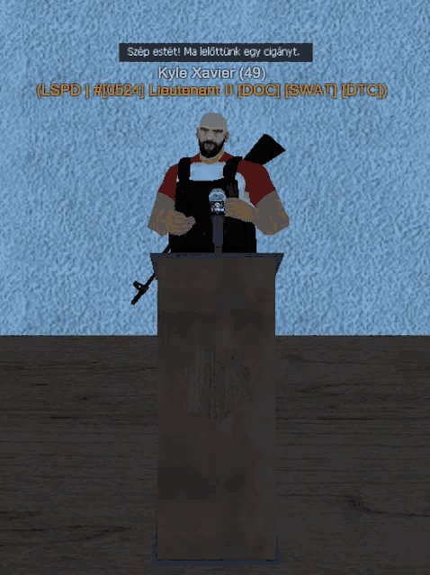 kyle xavier stands at a podium with a microphone