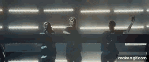 a group of people are standing on a stage with a make a gif.com link in the corner