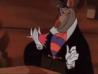 a cartoon character in a top hat is holding a small mouse in his hand