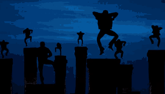 a group of people standing on top of chimneys in the dark