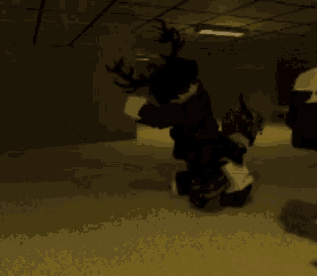 a person with antlers is standing on a yellow carpet