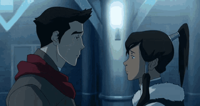 a man and a woman looking at each other in a hallway