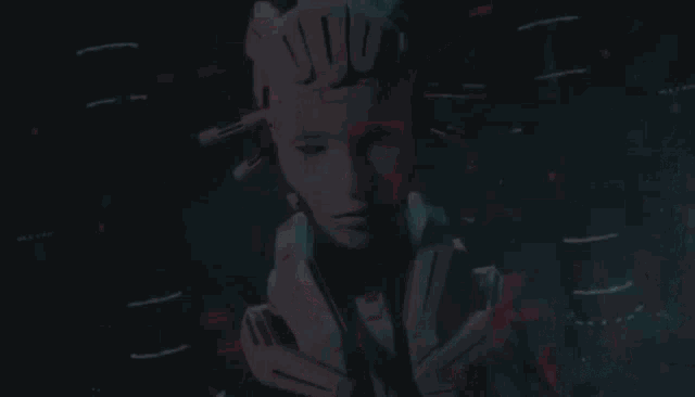 a robot with a cat 's head and ears is standing in a dark room with its eyes closed .