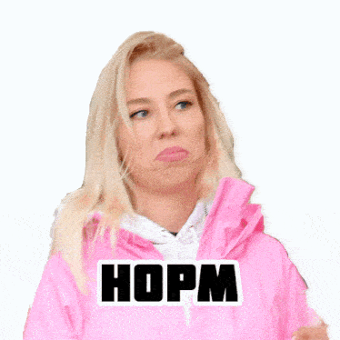 a woman wearing a pink jacket has a sticker on her jacket that says hopm