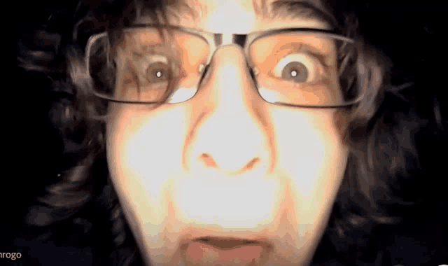 a close up of a person 's face with the word argo on the bottom left
