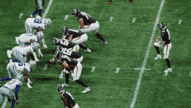 a football player with the number 16 on his back stands on the field