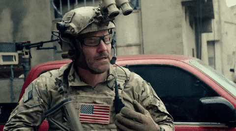 a man in a military uniform with an american flag on his chest