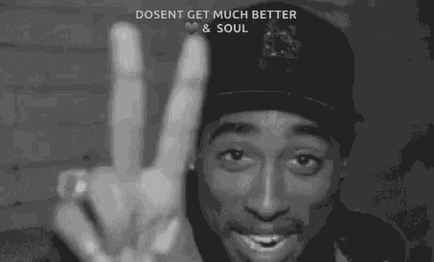 a black and white photo of a man giving a peace sign with the caption " dosent get much better & soul "