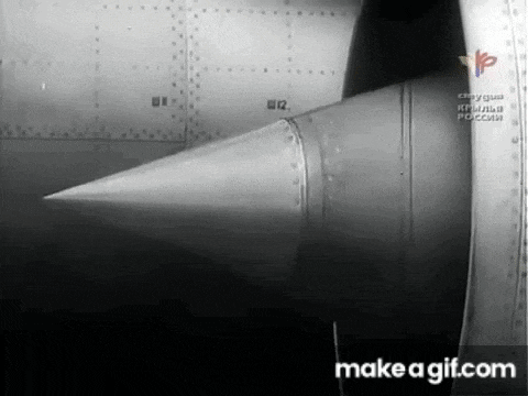 a black and white photo of a jet engine with the words make a gif.com below it .