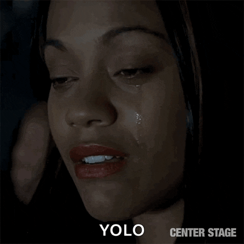 a close up of a woman 's face with a tear coming out of her eye and the words yolo center stage below it