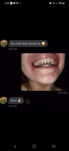 a close up of a person 's mouth with a smiley face on it and a picture of their teeth .