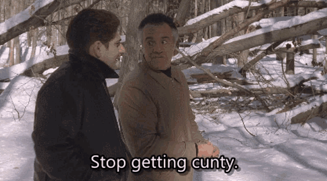 two men are standing in the snow and one of them says stop getting cutty