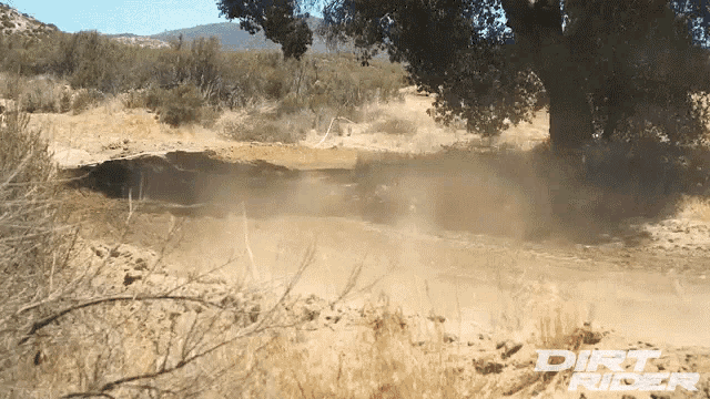 dirt rider is written on a dirt road